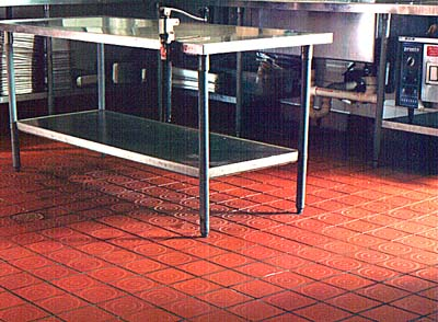 Safety Grooving by Diamond Safety Concepts, installed on a quarry tile floor in a restaurant kitchen